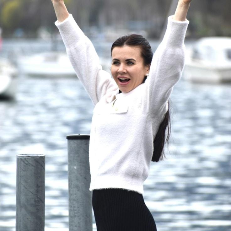 Kaveri Mehta, Lead Design Curator at PaperHavenBranch, reviewing corporate floral arrangements